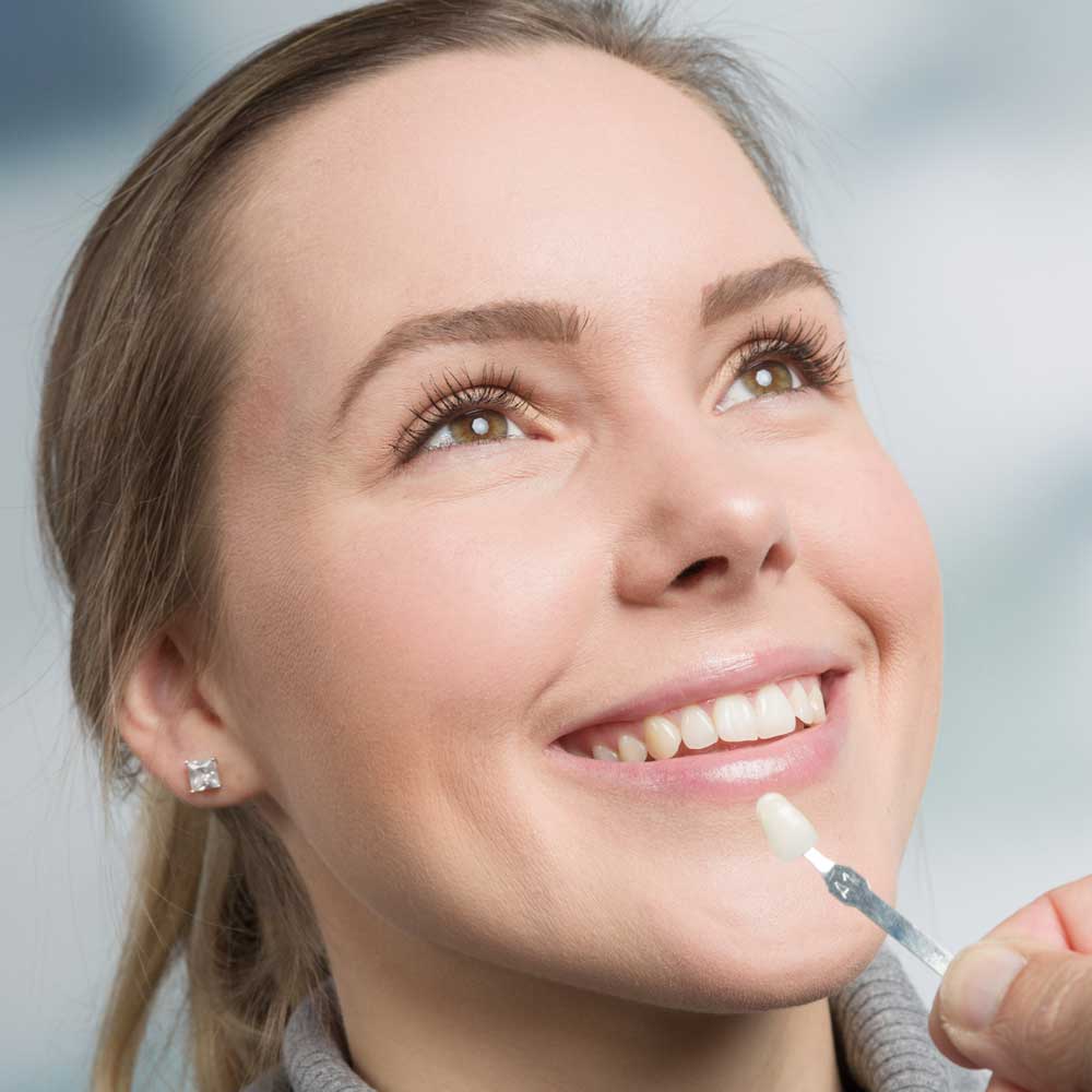 Patient having dental veneers