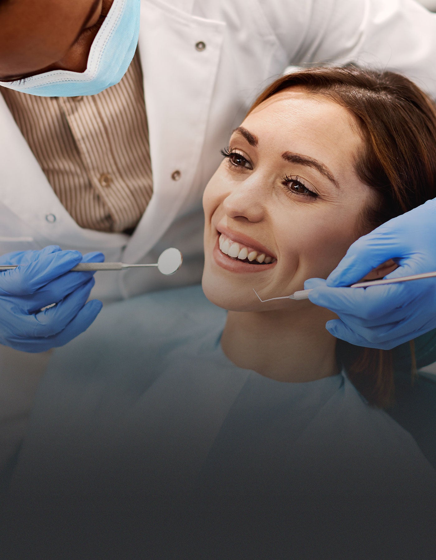 Nervous patient being made to feel at ease during dental treatment