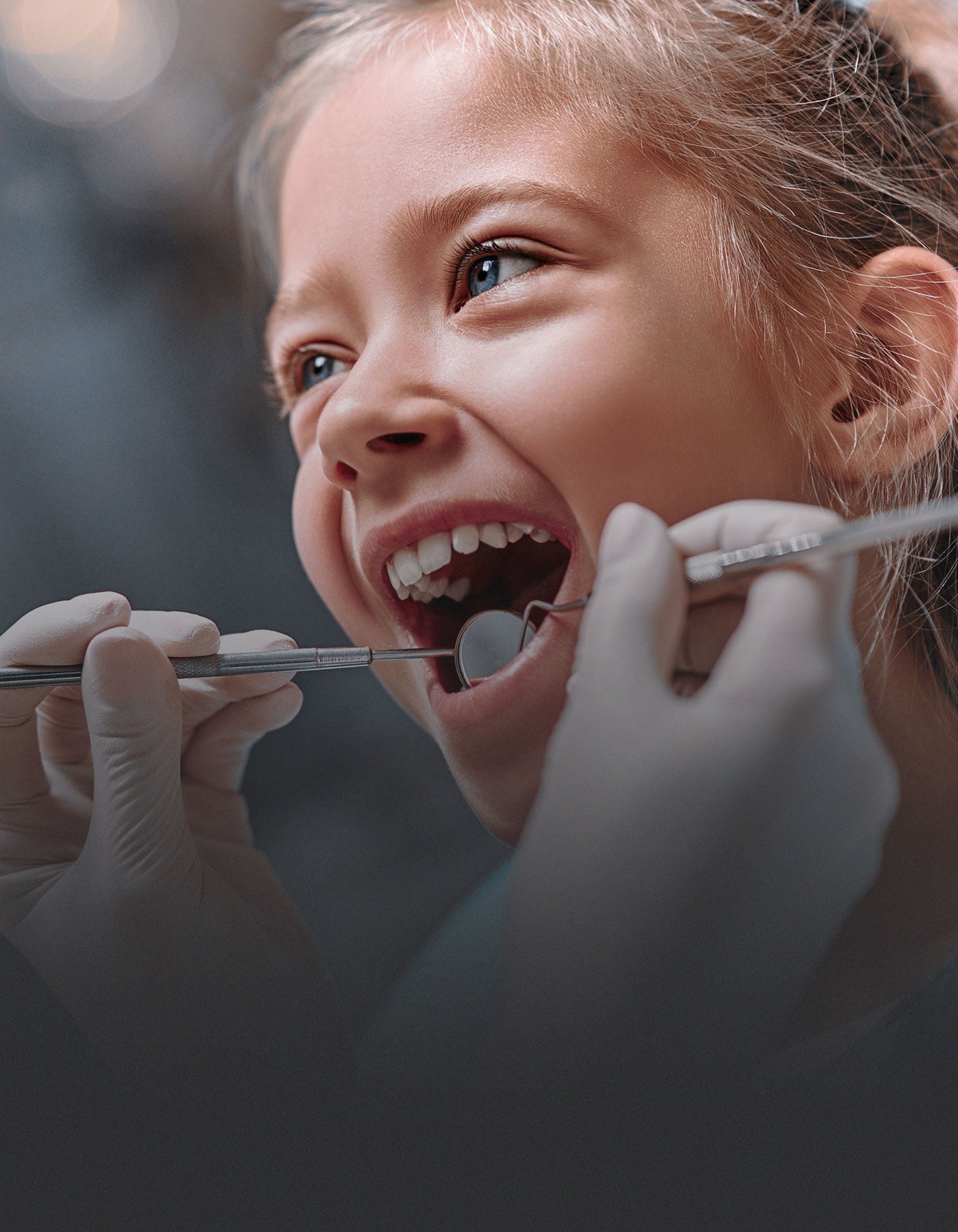 Child having teeth examined during a dental check up