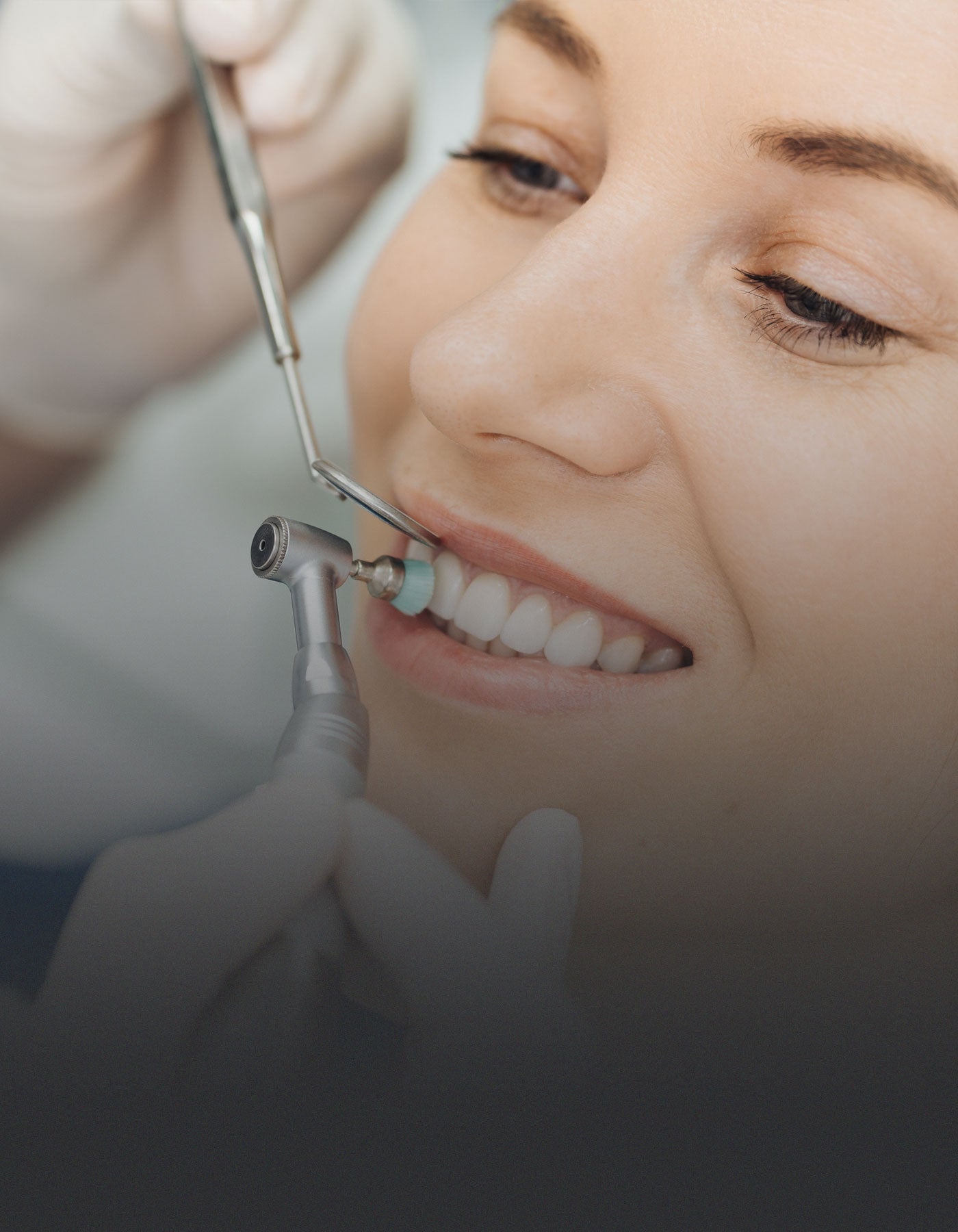 Patient having her teeth cleaned by the hygienist